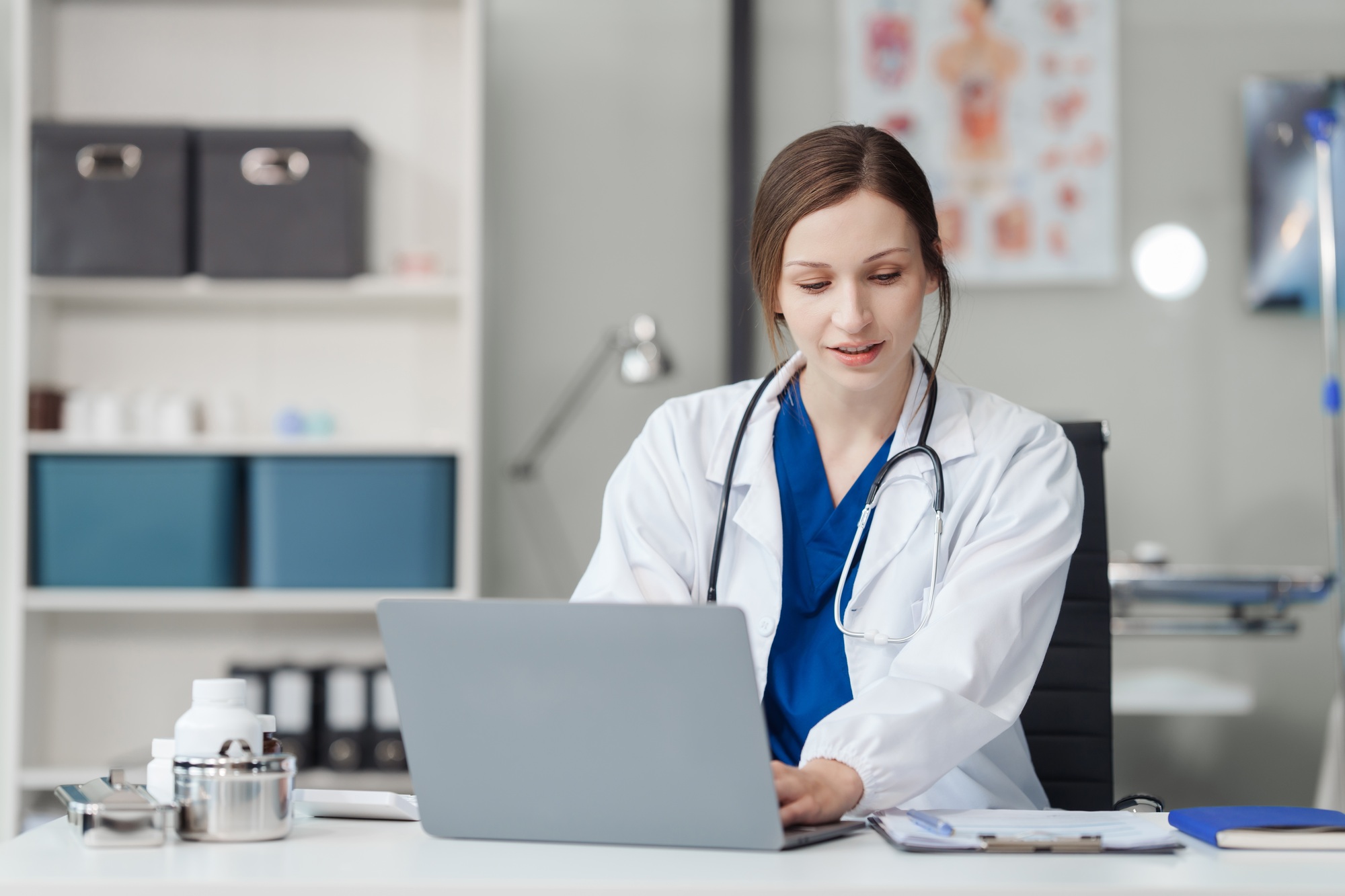 Attractive female Caucasian female doctor and psychologist gives advice, encouragement female Asian